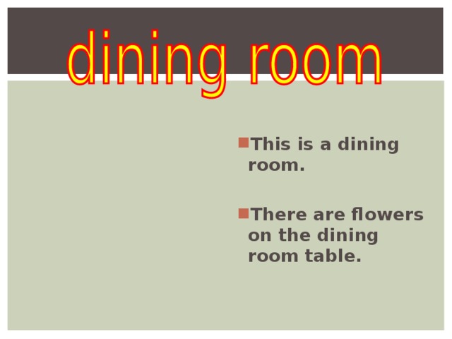   This is a dining room.  There are flowers on the dining room table.  