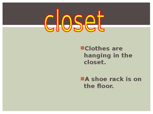   Clothes are hanging in the closet.  A shoe rack is on the floor.  