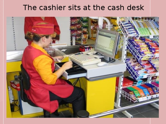 The cashier sits at the cash desk 