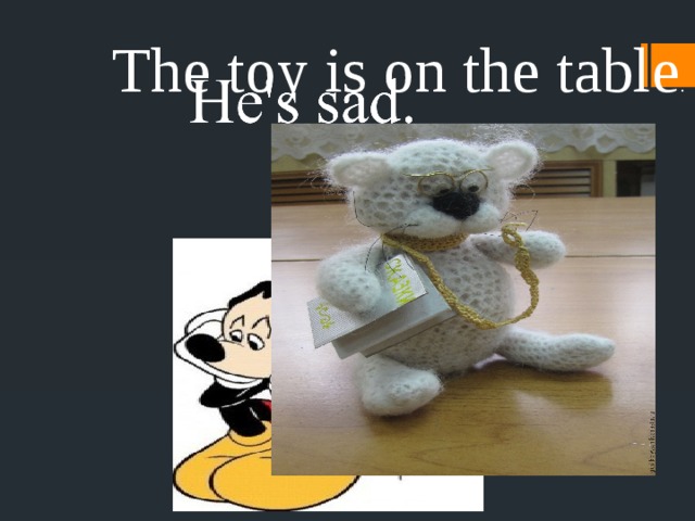 The toy is on the table . 