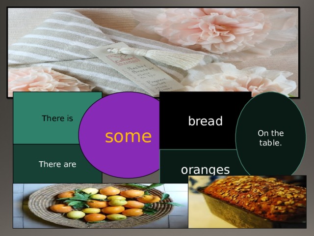 There is some bread On the table. There are oranges 