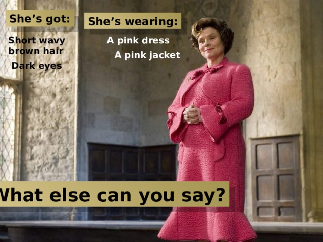 She’s got: She’s wearing: Short wavy A pink dress brown hair A pink jacket Dark eyes What else can you say? 