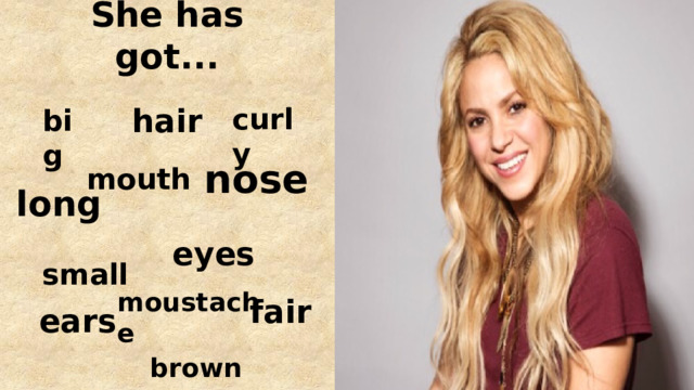 She has got... curly hair big nose mouth long eyes small moustache fair ears brown 